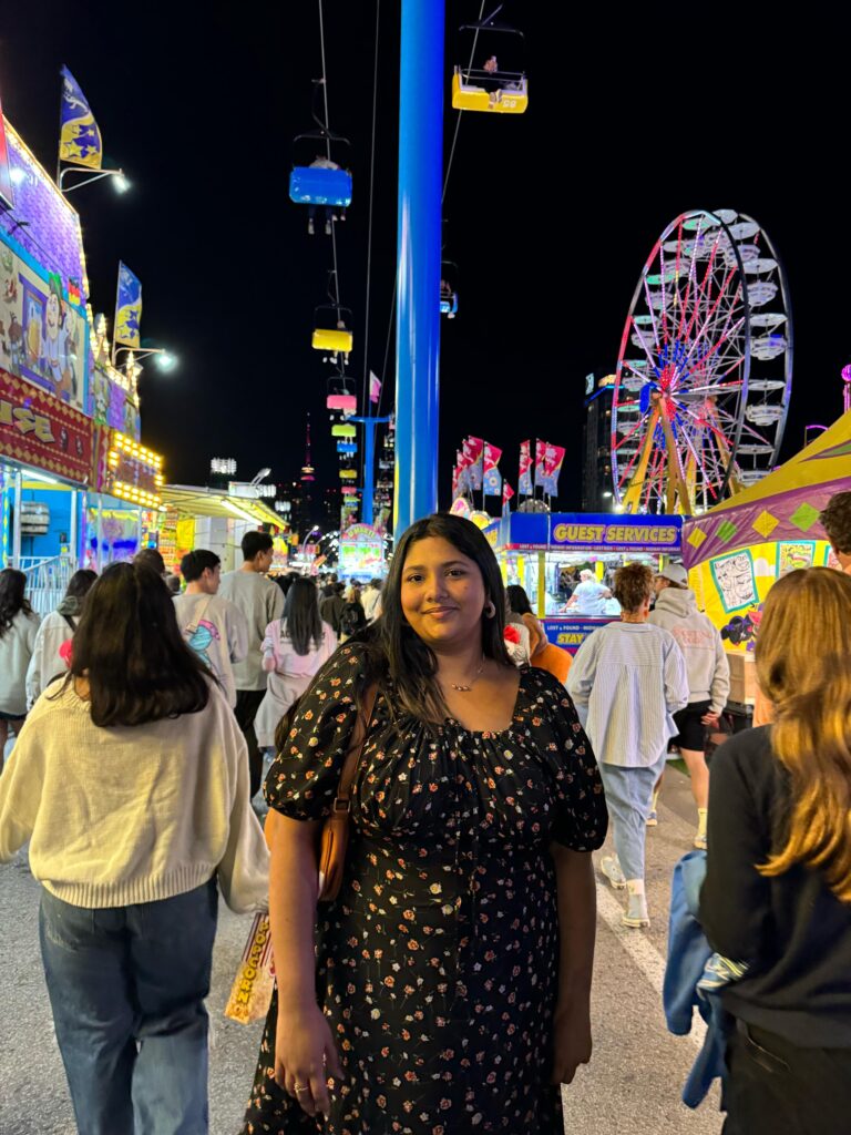 Amatullah standing at a fair.