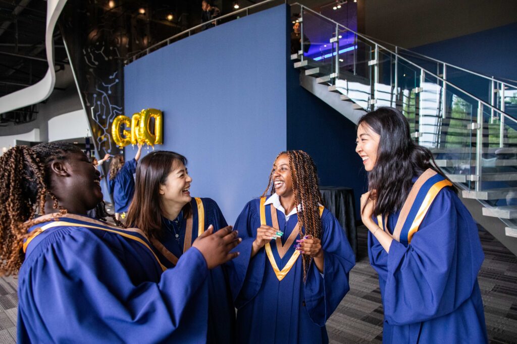 A group of Humber students happily talking to each other.