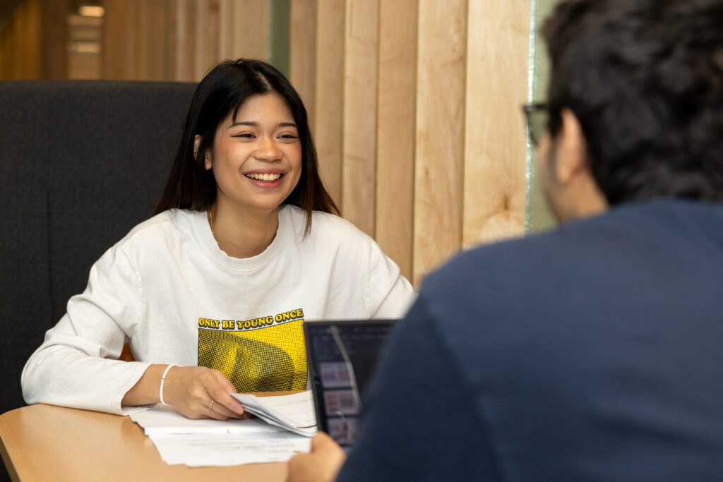 two students talking to each other