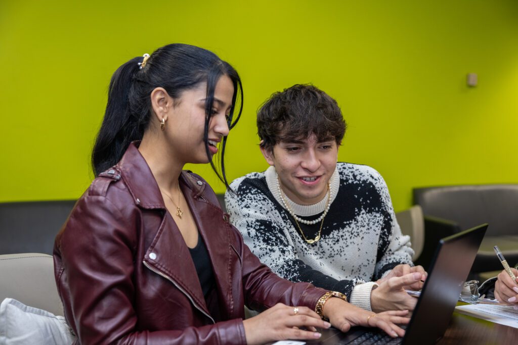 Two students engaged in conversation.
