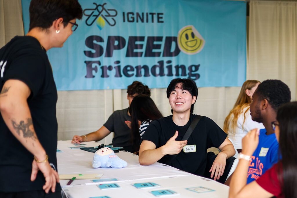 A group of people is sitting together at an event.