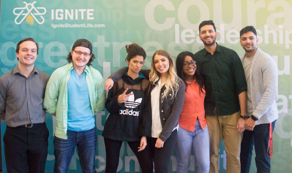 Students posing in front of an IGNITE banner.