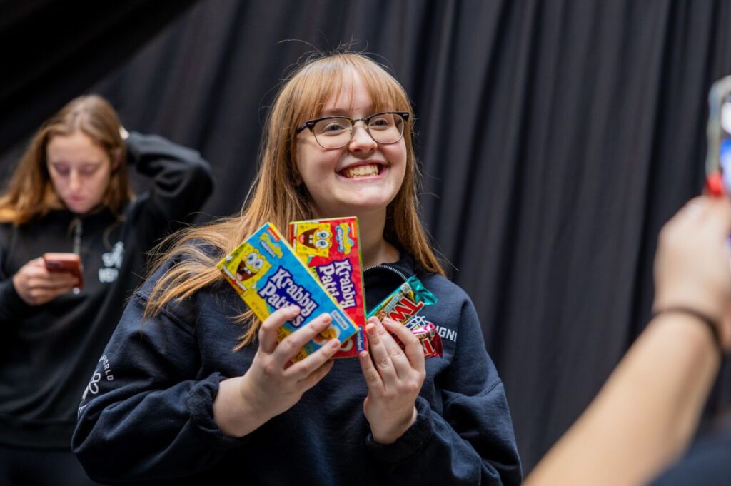 Emily Edwards flaunting spongebob candy at an IGNITE event.
