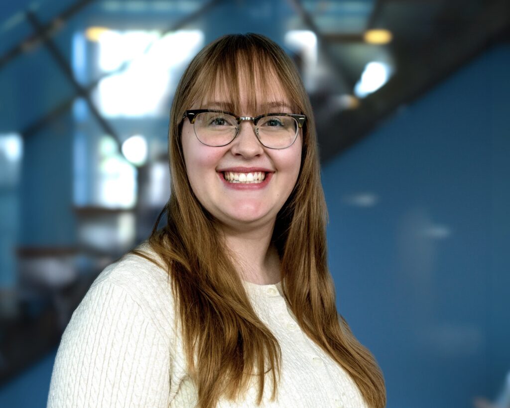 IGNITE Student Advocate Emily at Humber College smiling indoors on campus