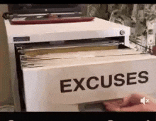 A person flipping through a filing cabinet labeled 'EXCUSES,' as if searching for an excuse.
