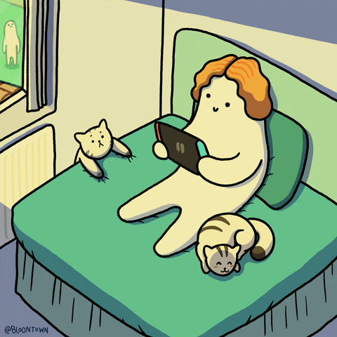 An animation of an all white figure, holding a game console while a cat hangs off one side of the bed and another sleeps soundly on the other. 