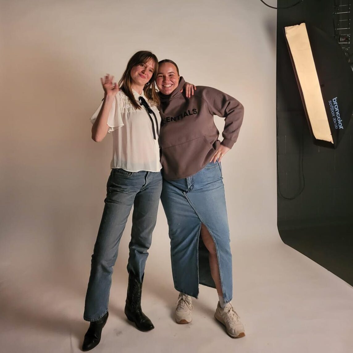 College girl best friends posing at a photoshoot