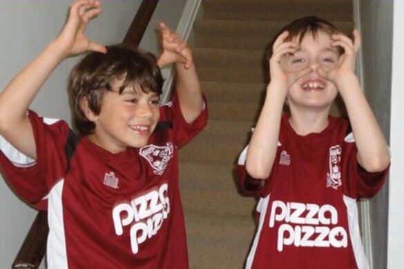 Kids having fun while wearing a 'Pizza Pizza' sports shirt