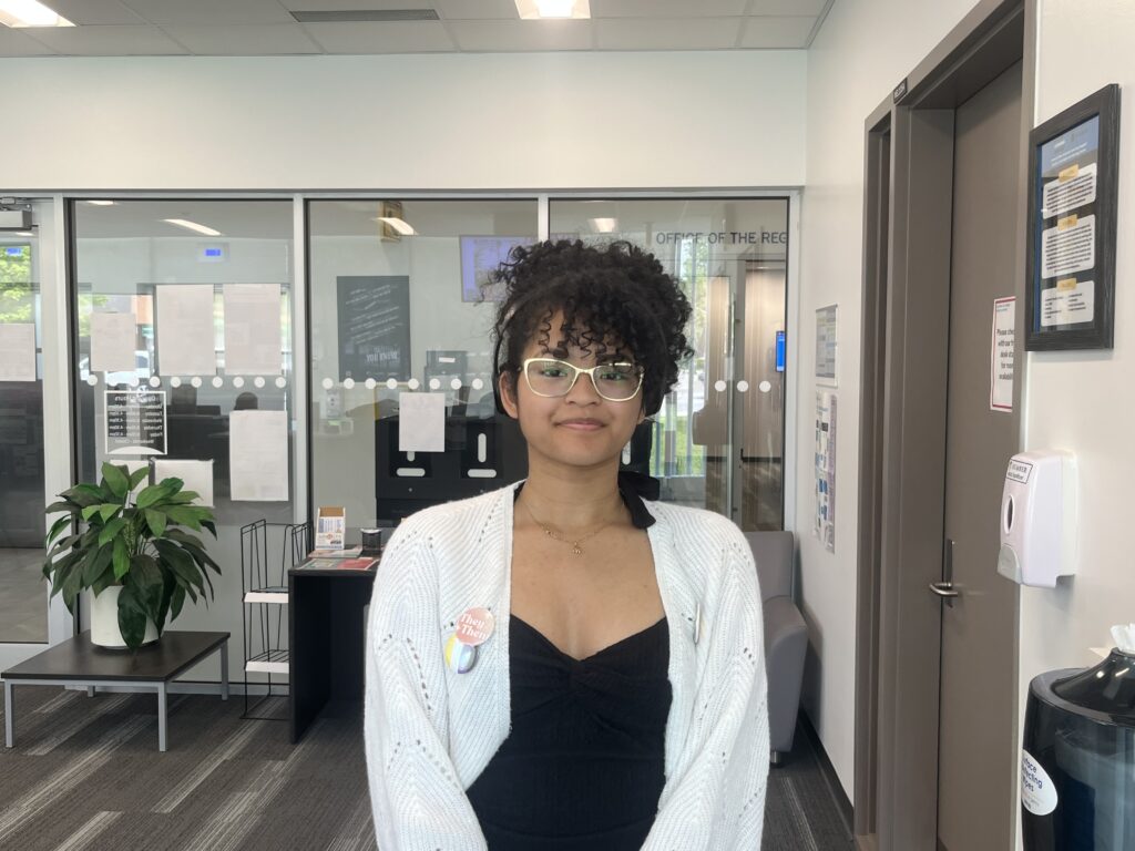 A person is standing in an office. 