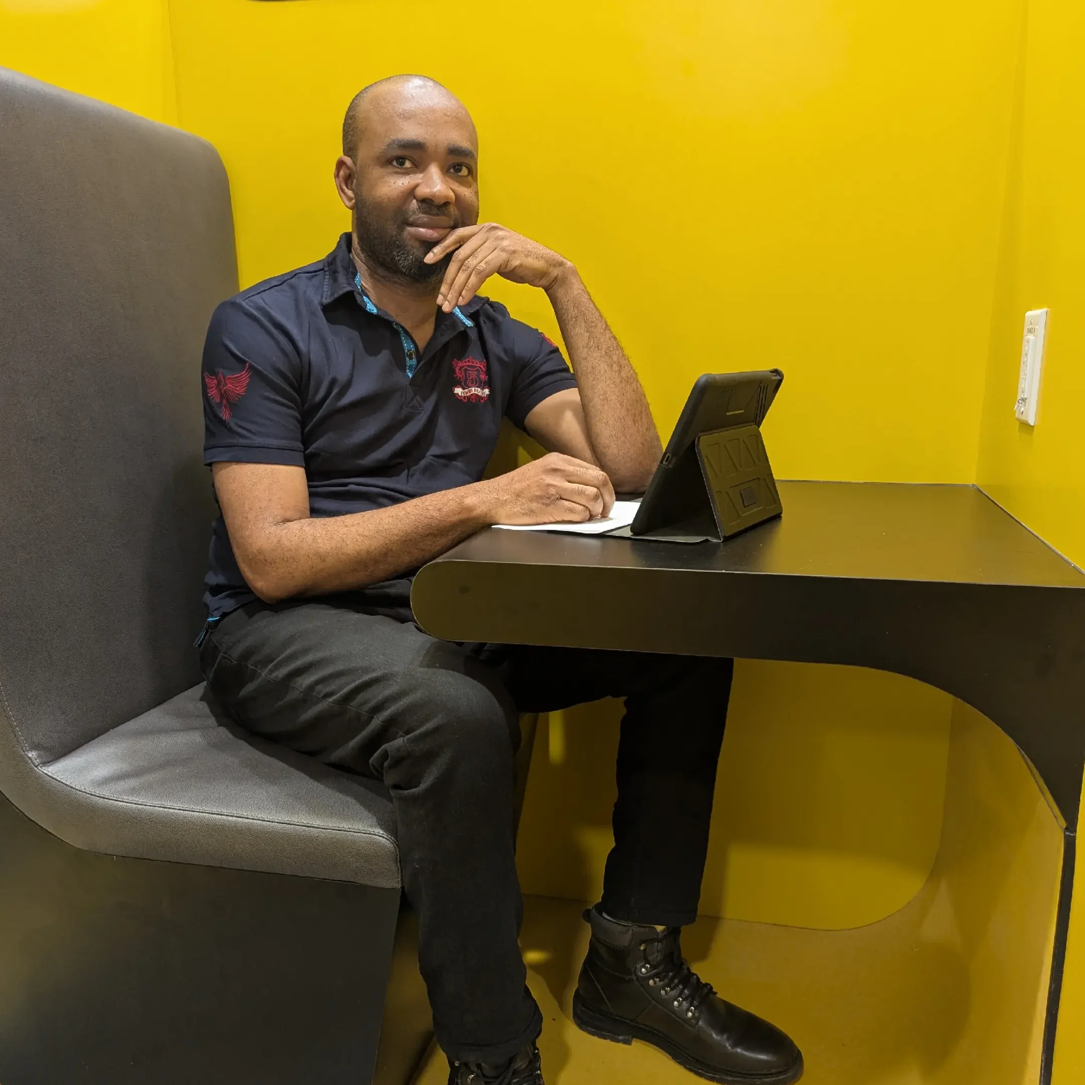 Ignatius Chika Ijezie sitting at Humber study booths