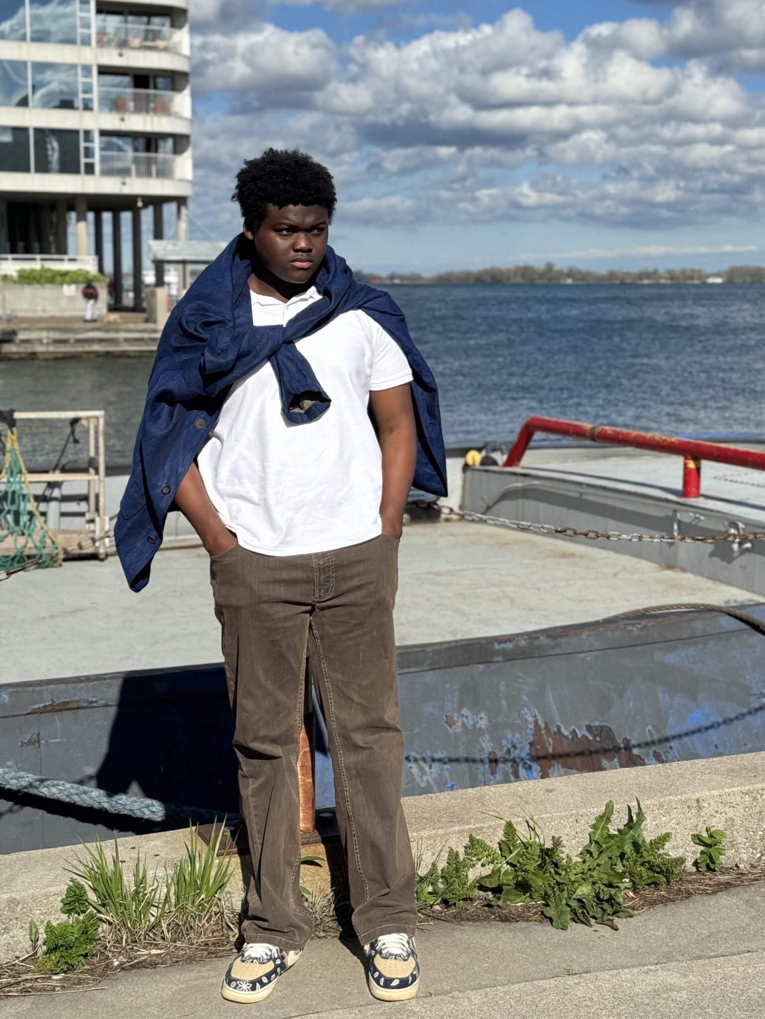 Issac Ofori Atenka posing near the water front