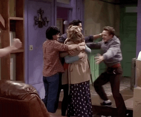 A group of people hugging.