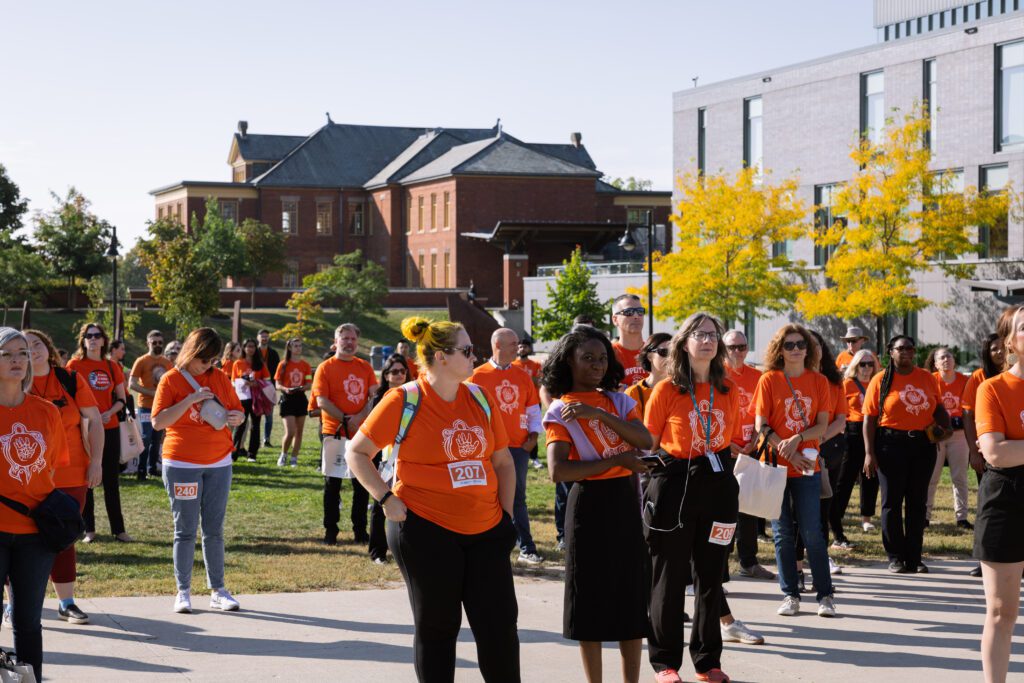 Group of people wearing orange at the Walk for Reconciliation at Humber Lakeshore campus.