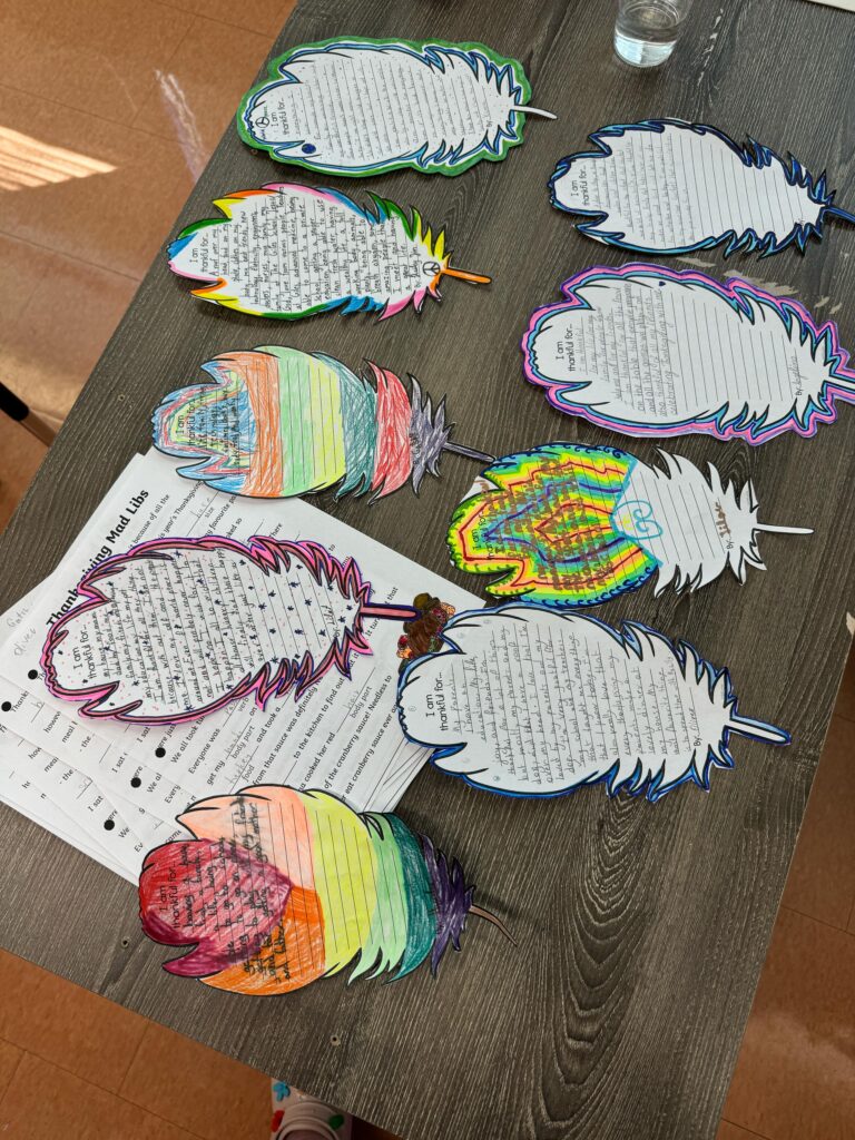 Student assignments neatly arranged on a desk.