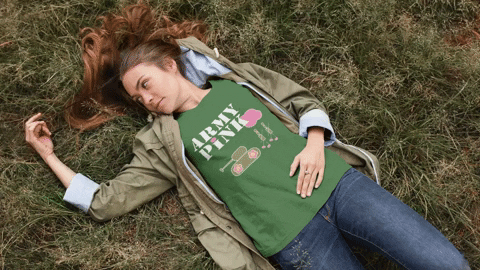 A woman is lying on the grass.