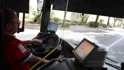 A man is driving the bus.