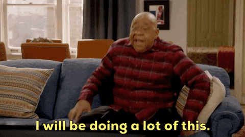 A man is sitting on the couch and saying the words, "I will be doing a lot of this."