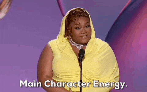A woman is saying the words, "Main Character Energy."