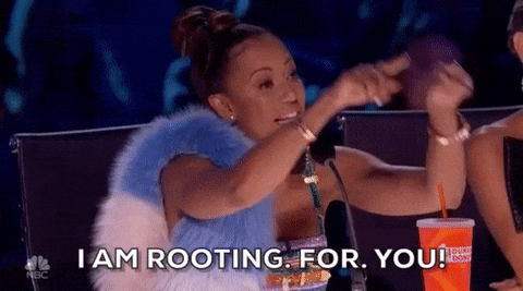 A woman is saying the words, "I AM ROOTING. FOR. YOU!"