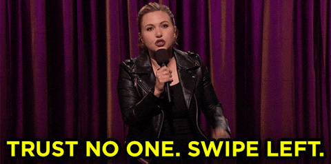 A woman holding a microphone and saying "Trust no one. Swipe left."