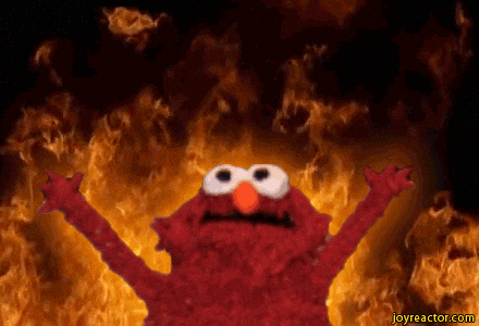 Red muppet on fire with his arms open.
