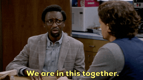 A man is telling another man "We are in this together."