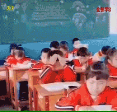 A boy pretending to scoop the contents of his book with his hands and pouring it to his head.