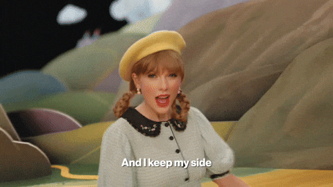 Taylor Swift sweeping in a yellow brick road. The gif text reads, "And I keep my side of the street clean."
