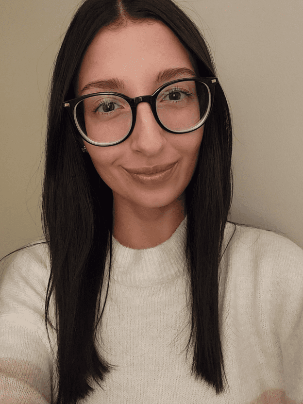 A woman is smiling.