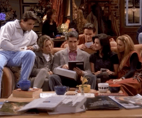 A group of friends sharing a couch.