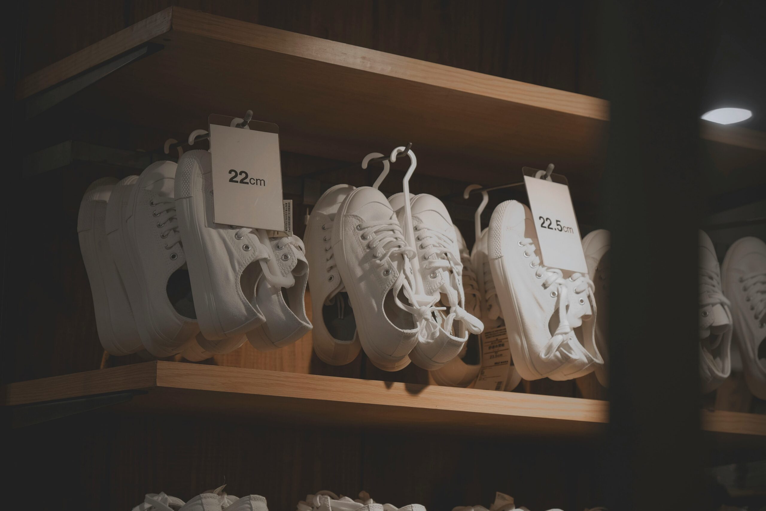 Low exposure photo of shoes on shelf