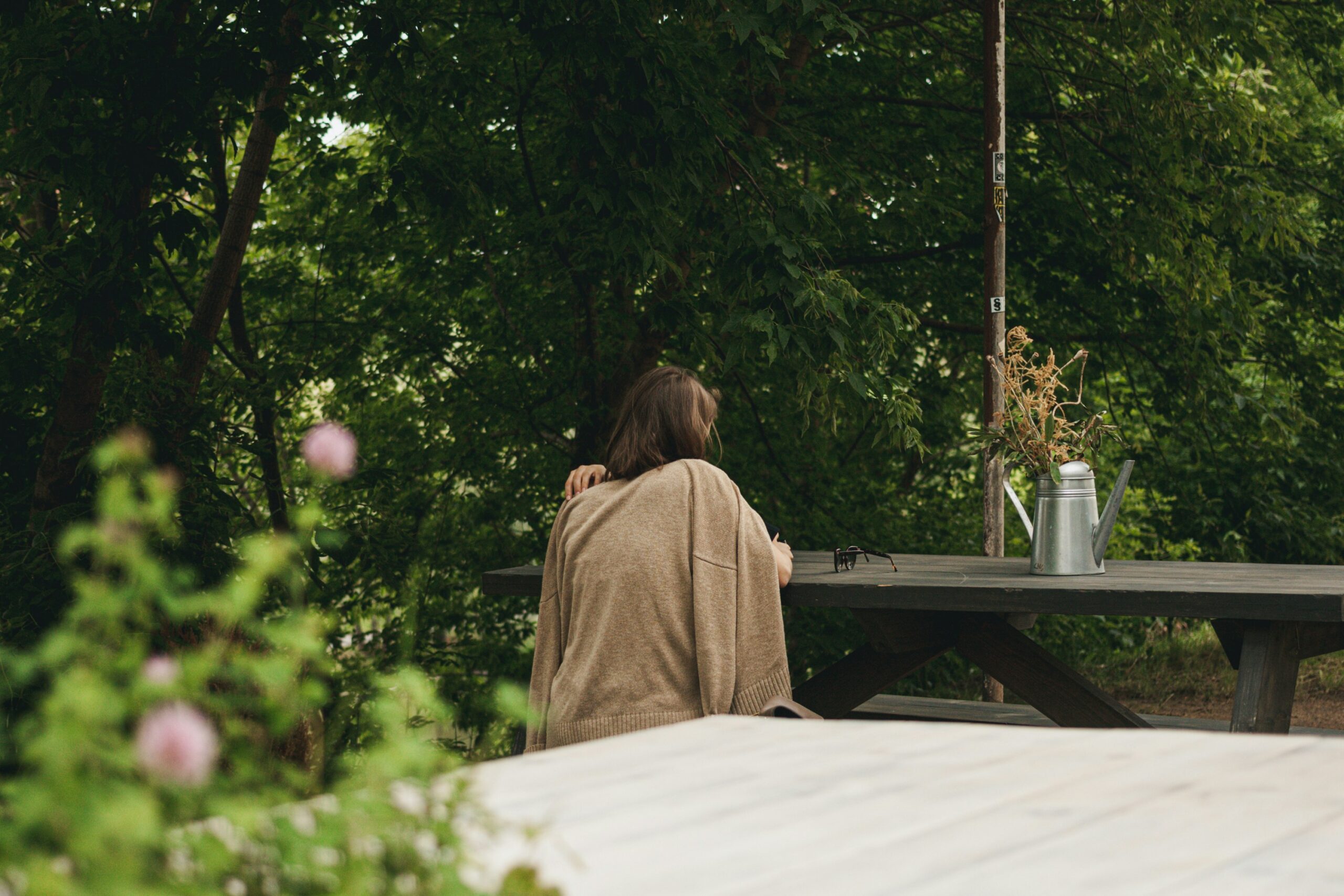 a person sitting on a bench outdoors