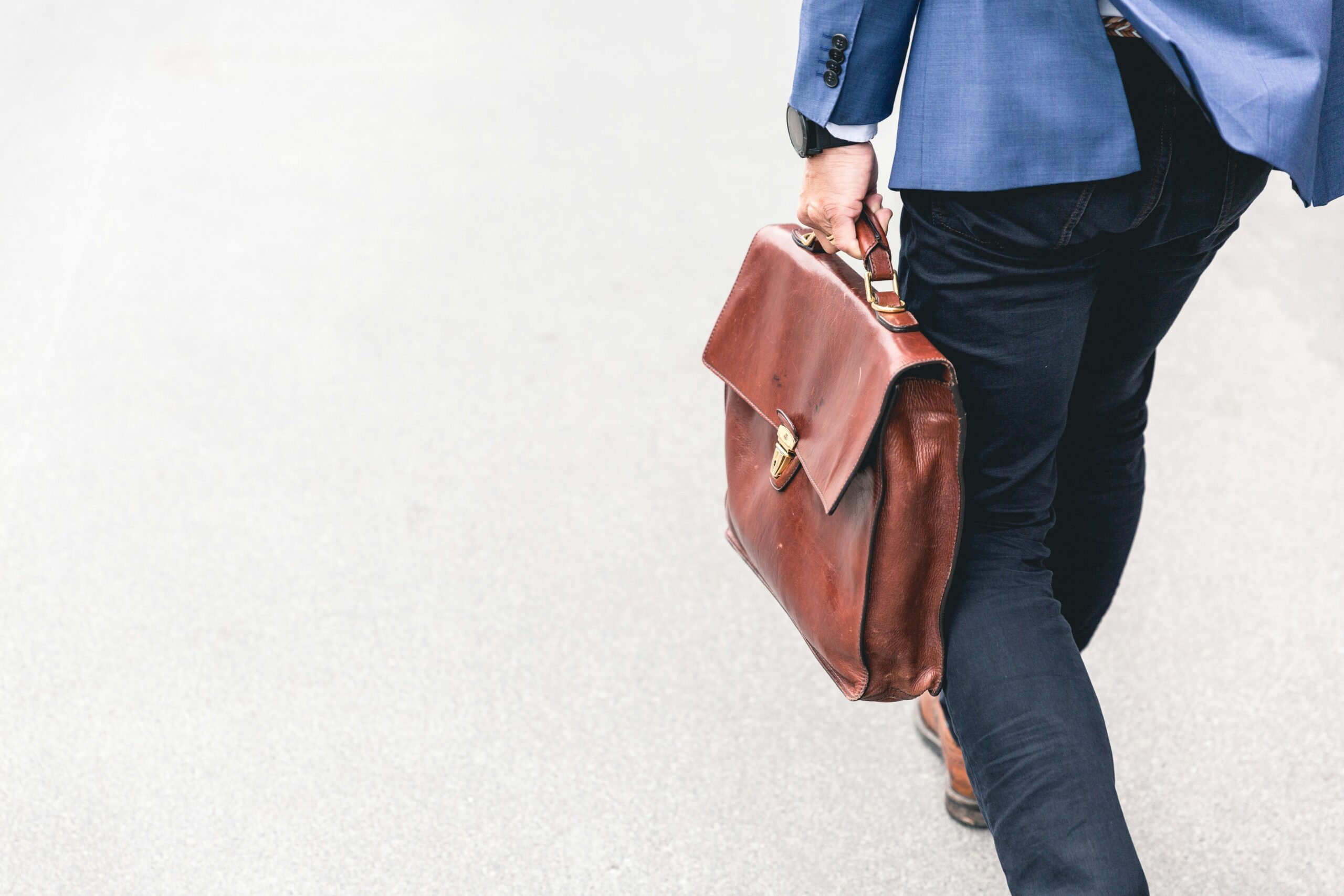 A office person carrying a work bag