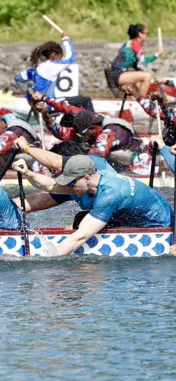 James Pashutinski rowing at a competitive boating event