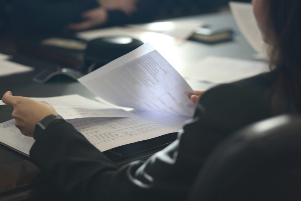a blurred image of a person flipping between papers