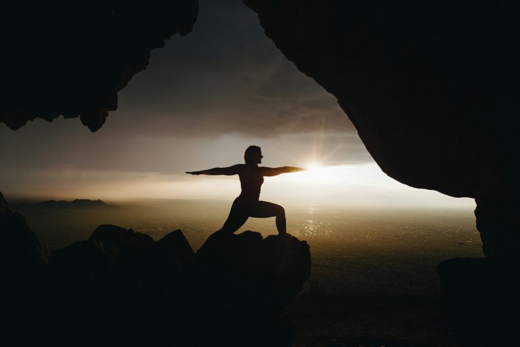 A person doing Yoga in a cave