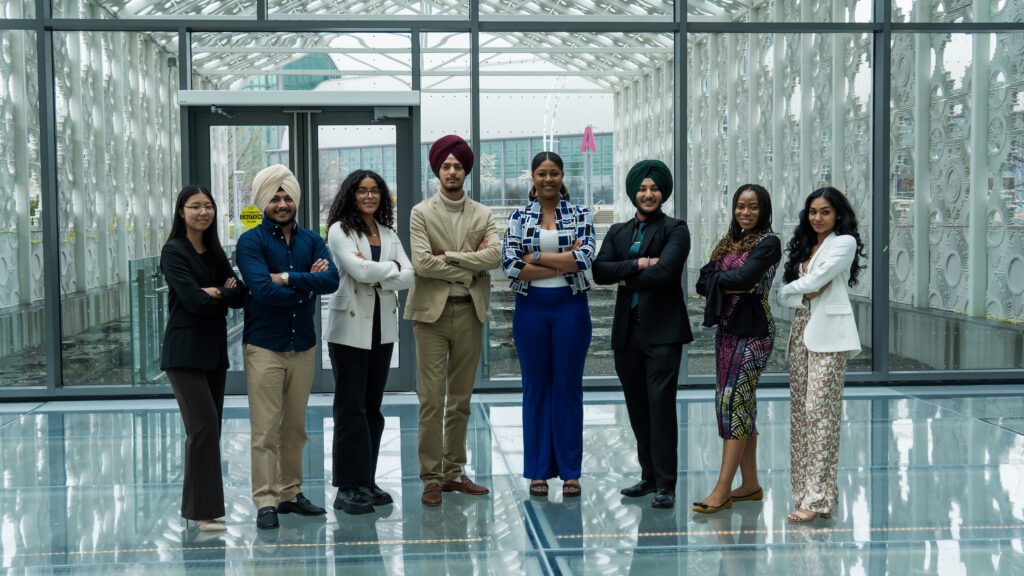 A picture of the 2023-24 IGNITE Board of Directors. Eight people are in the picture.