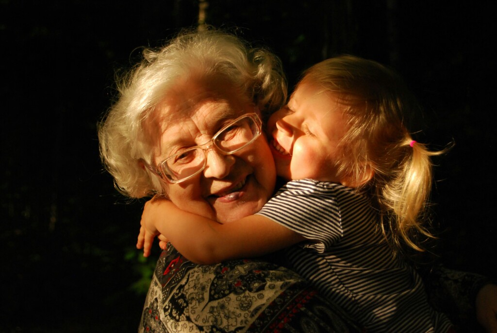 A grandma and grand dauther talking to each other