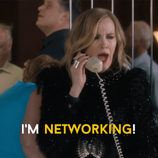 Woman on the phone saying "I'm networking."