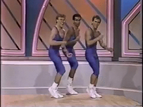 Thee men dressed in blue unitards dance.
