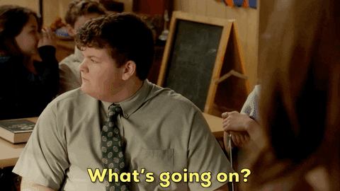 A boy is looking around and saying "What's going on?"