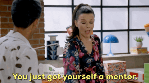 A woman is telling a man "You just got yourself a mentor."