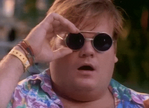 Gif of man lifting up his shades in awe