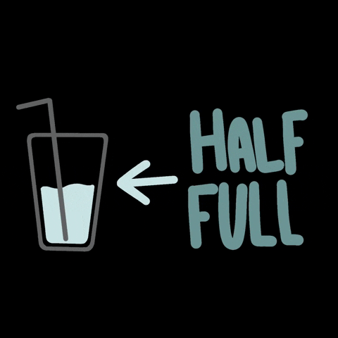 A drawing of a cup with liquid and a blinking sign saying 'Half Full' with an arrow pointing to the cup.