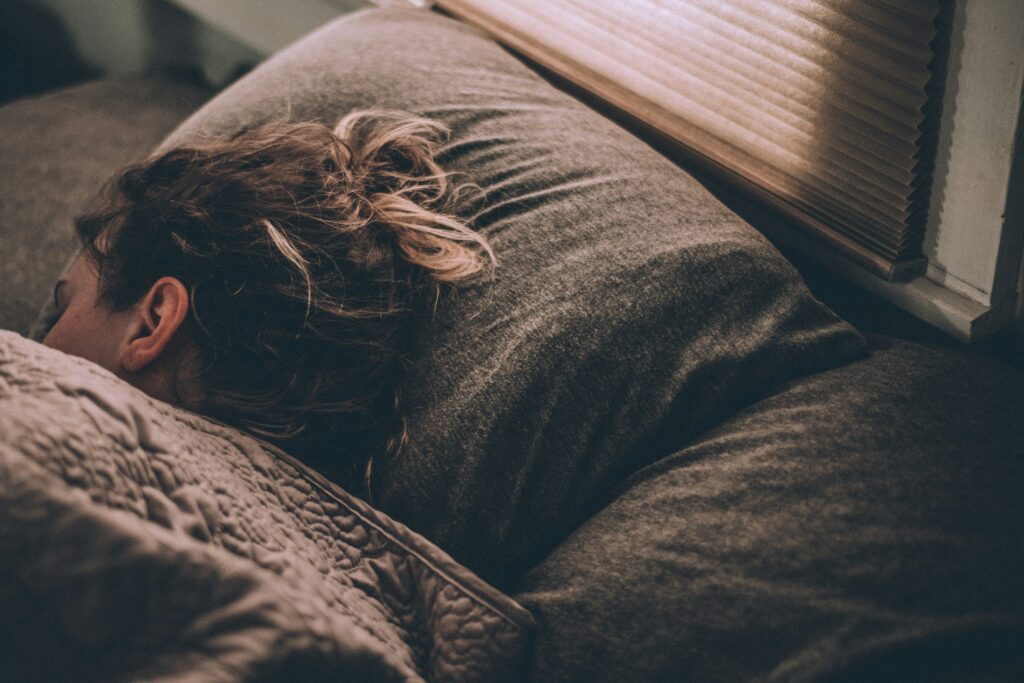 an image of a woman cozily sleeping