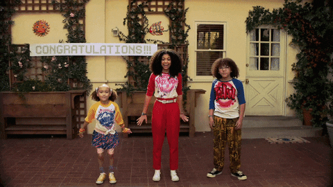 three people jumping to take a picture