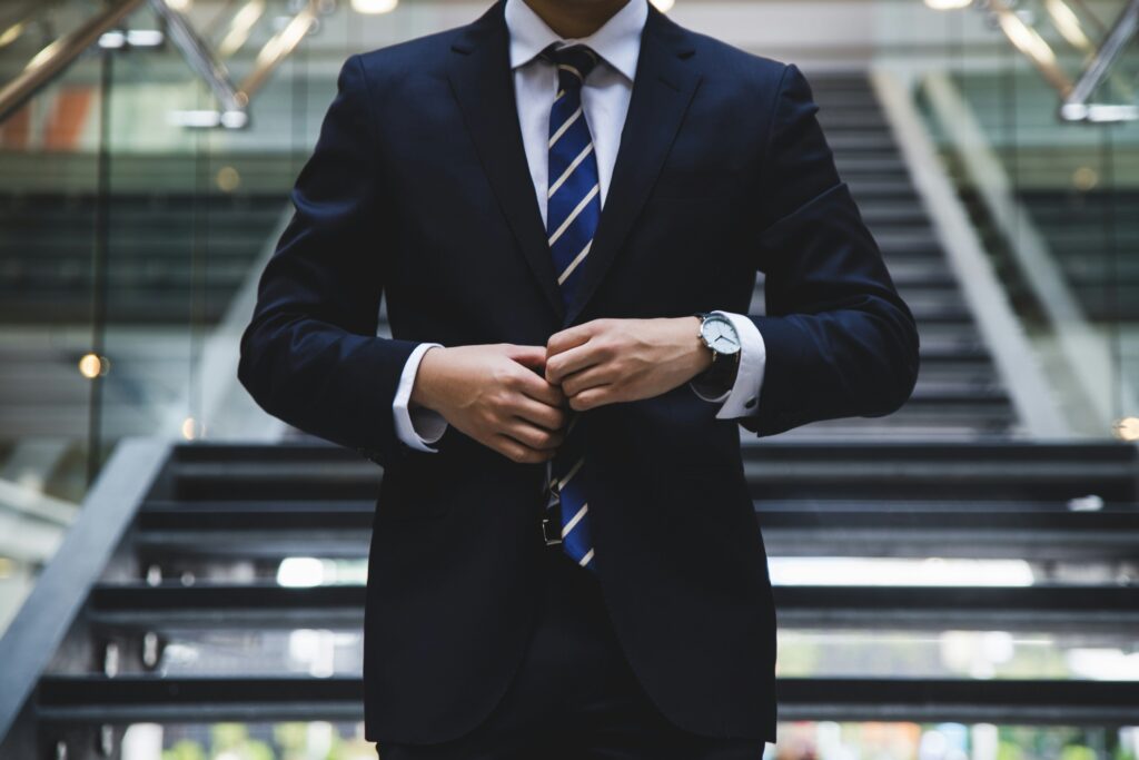 A lower shot of a man wearing professional office wear