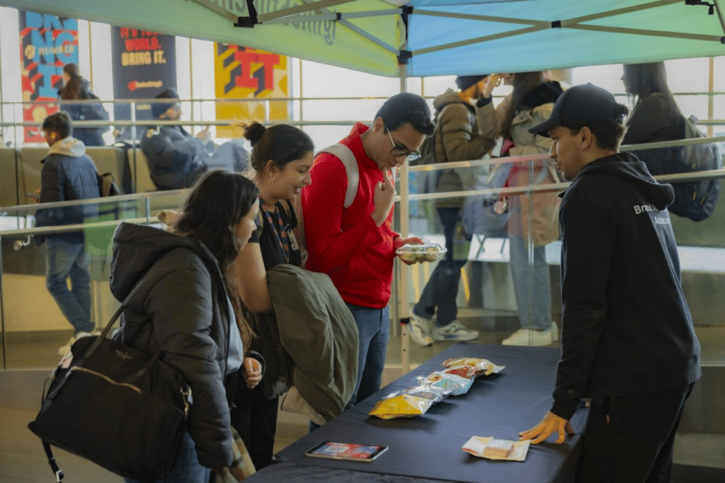 a group people picking snacks