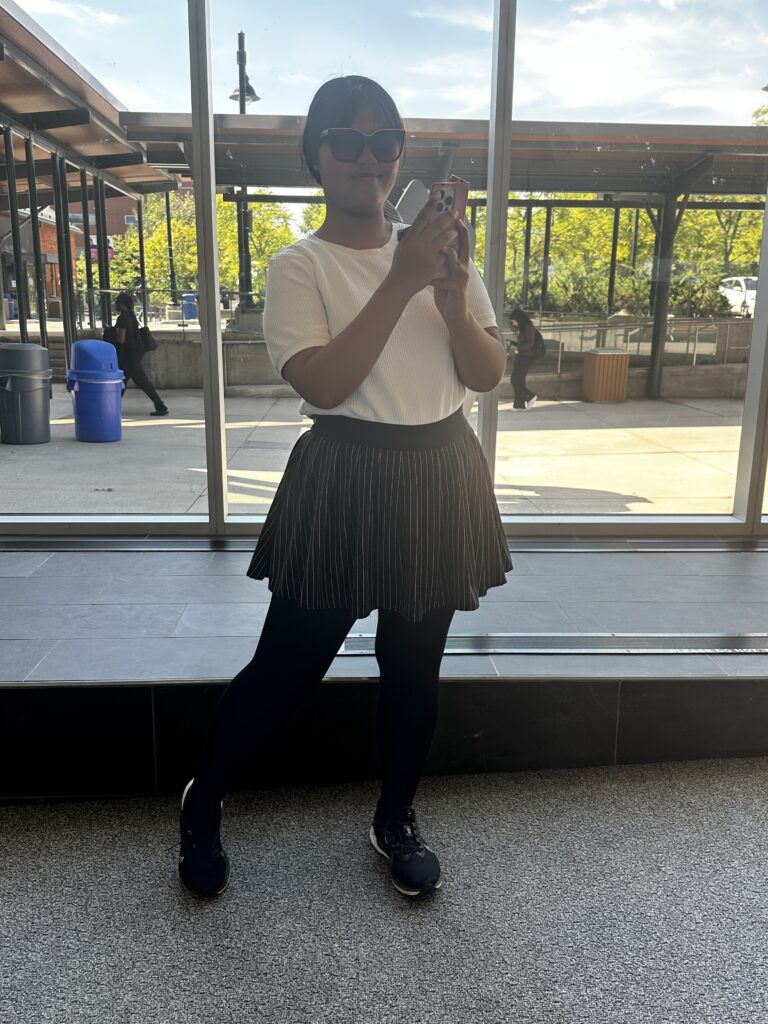 A student posing for a picture. Street Styles.