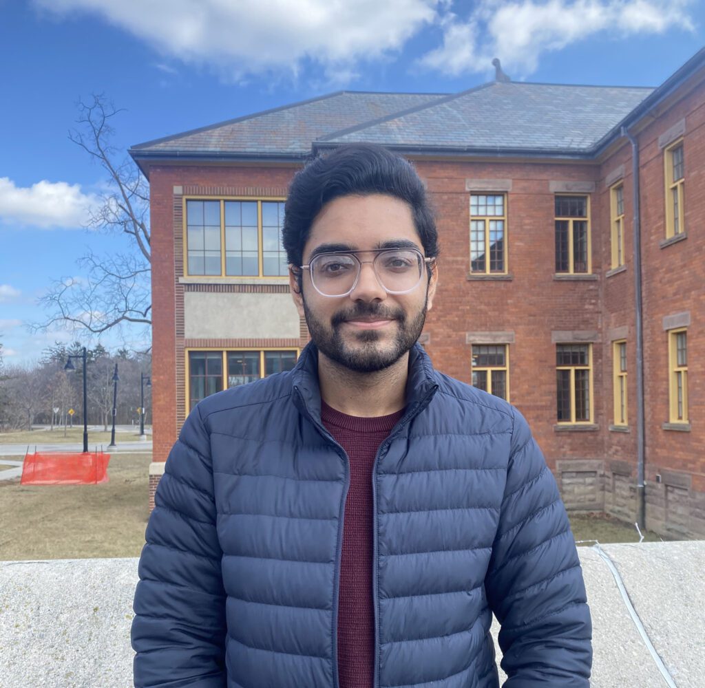 a student in front of a building